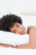Portrait of a cute woman hugging her pillow