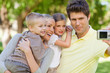 A focus shot of the family as they pose for a photo