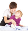 housework - young mother ironing with little daughter