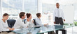 Salesman with flip chart giving a presentation for his colleagues