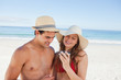 Close-up of a couple in swimsuit checking their picture 