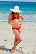 Attractive woman in bikini holding a starfish 