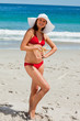 Portrait of an attractive woman in bikini holding a starfish 