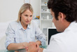 Woman listening closely to doctor