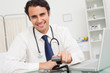 Smiling doctor hanging up the phone