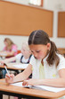 Primary student working on exercise book