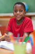 Smiling student sitting at desk during class