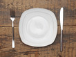 Empty dish knife and fork on wood table Empty dish knife and fork on wood table