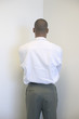 Businessman facing wall