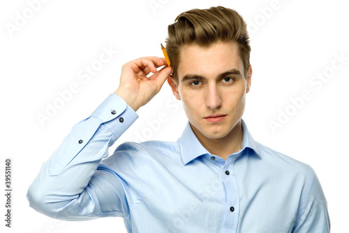 Foto: Man with a pencil behind his ear Man with a pencil behind his ear