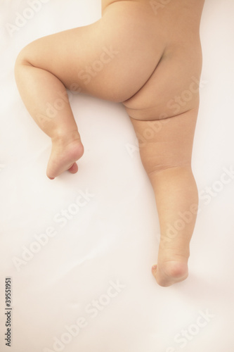 Photo: Naked baby's bottom and legs Naked baby's bottom and legs