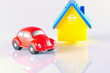 small red toy beetle car and house