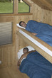 Men sleeping in bunk beds