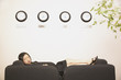 Businesswoman sleeping on couch in office