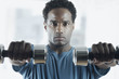 Portrait of man lifting weights