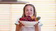 Housewife smelling a fruit bowl