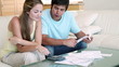 Young couple doing their accounts 
