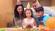 Girl celebrating her birthday with her family