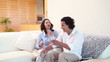 Man bringing champagne to his wife
