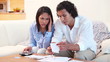 Couple adding up their bills