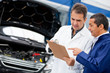 Mechanics fixing a car