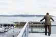 Rear view of businessman looking out over harbor