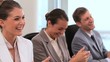 Colleagues applauding together