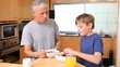Father and son eating together