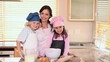Smiling mother cooking with her children
