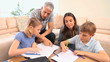 Children drawing next to their parents