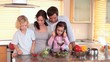 Video: Smiling children cooking with their parents Smiling children cooking with their parents