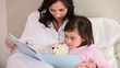Video: Smiling mother reading a book aloud Smiling mother reading a book aloud
