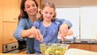 Video: Mother and daughter mixing a salad Mother and daughter mixing a salad