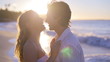 Couple kissing and turning during sunset on the beach