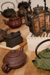 A collection of antique ceramic Asian teapots