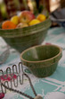 Vintage bowls, potato masher, and citrus fruits