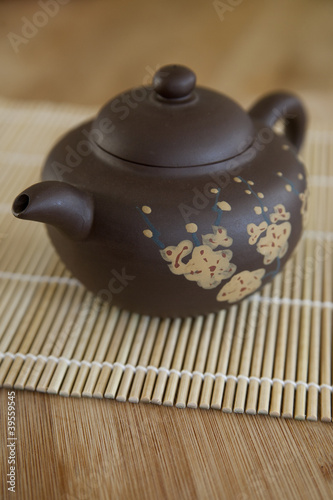 Photo: Small Asian ceramic teaot with cherry blossom motif Small Asian ceramic teaot with cherry blossom motif