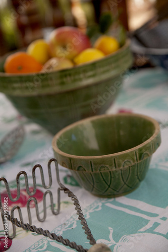 Photo: Vintage bowls, potato masher, and citrus fruits Vintage bowls, potato masher, and citrus fruits