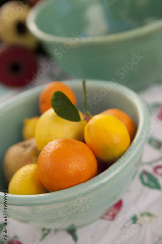 Photo: Fresh citrus fruits in a vintage ceramic bowl Fresh citrus fruits in a vintage ceramic bowl