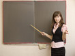The young woman with a pointer at school boards