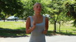 Video: A woman jogs while looking around A woman jogs while looking around