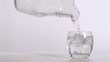 Pouring water in slow motion from a pitcher