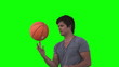 Man playing with a basketball in slow motion