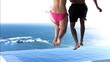 Couple dipping into the water in slow motion
