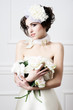 Portrait of beautiful retro bride with wedding bouquet