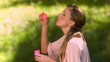 Video: Woman making bubbles in slow motion Woman making bubbles in slow motion