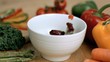 Vegetables falling into bowl in super slow motion