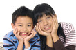 happy kids boy and girl lie on floor