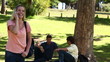 Video: Woman laughing as she talks on a phone before hanging up and looking at the camera Woman laughing as she talks on a phone before hanging up and looking at the camera