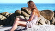 Woman applying sunscreen on her body